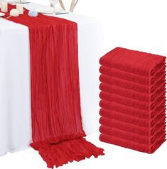 the table is set with red and white linens