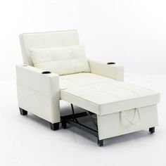 a white leather reclining chair and ottoman with cup holders on the armrests