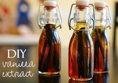 three bottles filled with liquid sitting on top of a table