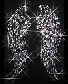 the words nicholas written in front of an image of two angel wings with sparkling sparkles