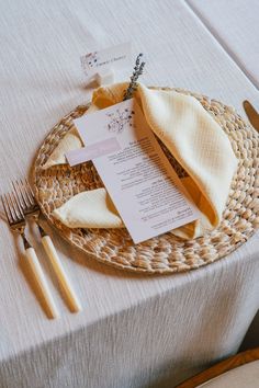 a place setting with napkins and forks