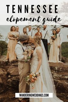 a bride and groom kissing on top of a mountain with their wedding party in the background