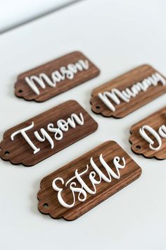 six wooden name tags with the names of each family