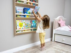 We combine Montessori Bookshelf Wall Mounted with Wooden Floating Toddler Book Shelf. Here is Small Space Nursery Bookcase Toddler Furniture and Kids Room Baby Bookshelves! This shelf was mounted and wood book shelf can be best gift from family to new baby boy or girl, toddler or kids.  Floating kids shelf will be perfect matches with her or him toddlers furniture. Unique design wall-mounted display and nursery bookcase will be perfect gift as a Montessori furniture and kids book storage. Book display shelves use as kids room shelves. This sturdy and skinny  baby bookshelves will be best space saver bookcase gift for kids room as a decor. The bookshelf is made from 12mm Baltic birch plywood. Since it is crafted from natural wood, the patterns on each bookshelf may differ slightly from the Shelf Small Space, Bookshelf Wall Mounted, Kids Book Shelf, Baby Bookshelf, Nursery Bookcase, Kids Shelf, Kids Room Shelves, Kids Room Bookshelves, Montessori Bookshelf