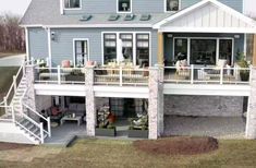 an aerial view of a house with stairs leading up to the upper level and second story