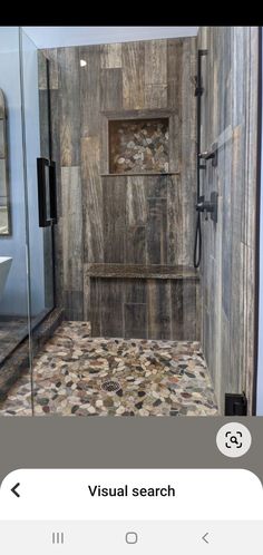 a walk in shower sitting inside of a bathroom