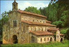 an old church in the middle of a forest