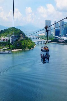 a cable car is going over the water