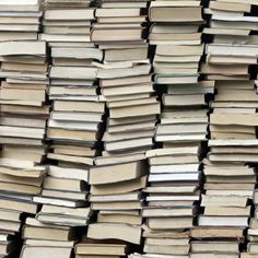 stacks of books stacked on top of each other