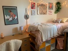 a bed room with two beds and some lights on the wall next to each other