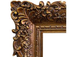 an ornate gold frame with flowers and leaves on the edges, isolated against a white background