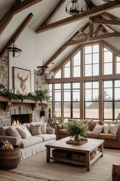 a living room filled with furniture and a fire place in the middle of an open floor plan