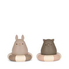 two ceramic animals sitting next to each other