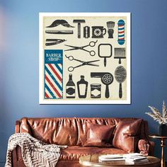 a living room with a brown leather couch and blue wall behind it is a barber shop poster on the wall