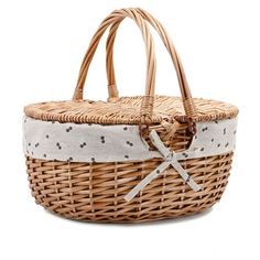 a wicker basket with white and black dots on the front, tied in a bow