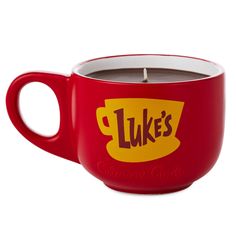 a red cup with a candle in it that says luke's california chilis