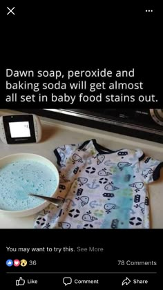 a bowl of food next to a t - shirt and cell phone on a counter