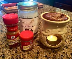 some jars and candles on a counter with text that reads, love the smell of fall but don't like your 3 tablespoos