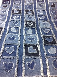 an old piece of denim with hearts drawn on it