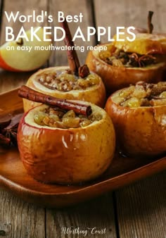 some apples are sitting on a plate with cinnamon and star anise in the middle