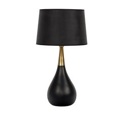 a black and gold lamp with a black shade on the bottom, in front of a white background