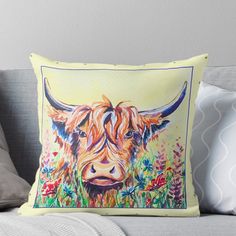 a painting of a cow with long horns on it's head sitting on a couch