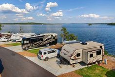 an rv park next to the water with parked campers