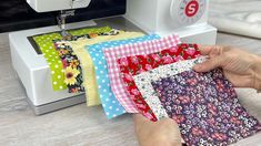 a person using a sewing machine to sew fabric