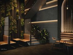 the interior of a restaurant with plants growing on the wall and wooden benches to the side