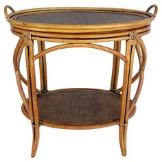 a wooden table with wicker and glass top