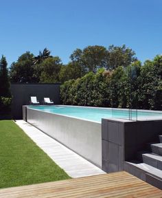 an empty swimming pool with steps leading up to it