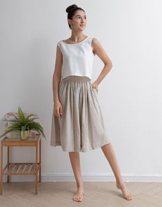 "This Pleated midi skirt is perfect for this summer, Crafted with 100% linen, featuring elasitc high waist and deep pocket, comfy and versatile ★★FEATURES 100% Linen Elastic waist Two side pockets Pleated skirt Regular fit A Line skirt No lining Perfect for Summer, Spring, Autumn ★★ Model Size Height approx 162 cm (5′ 4″) Bust 84 cm (33\") Waist 66 cm (26\") She wears size XS. ★★ Bespoke Order Service If you Request other color Request the length Your height is not between 155 cm- 172 cm Your we Summer Bottoms With Pockets, Midi Length, Summer Linen Midi-length Bottoms, Summer Linen Flowy Skirt, Summer Beige Flared Pleated Skirt, Linen Dresses With Relaxed Skirt For Spring, Flowy Linen Pleated Skirt, Casual Linen Summer Skirt, Casual Summer Culottes With Pleated Skirt, Linen Flared Skirt For Spring