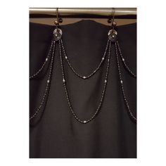 a black curtain with beads hanging from it's side