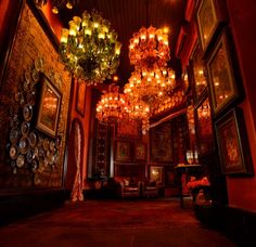 a room with chandeliers hanging from the ceiling