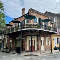 an old brick building with balconys and balconies on the second floor is shown