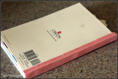 a pink and white box sitting on top of a counter