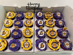 the cupcakes are decorated with purple and yellow icing, along with basketball decorations