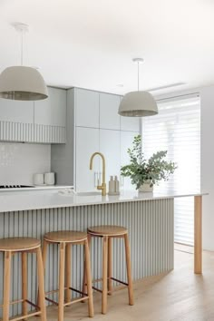 light sage coastal kitchen design breakfast bar oak timber bar stools white pendant lights panelled batten joinery Coastal Kitchen Design, Forest Lodge, Coastal Kitchen, House Design Kitchen, Kitchen Room Design, Kitchen Inspiration Design, Kitchen Color, Kitchen Style