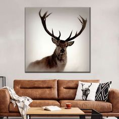 a deer with large antlers is shown in this living room