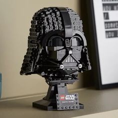 the lego darth vader helmet is on display