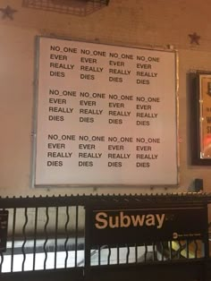 there is a subway sign on the wall