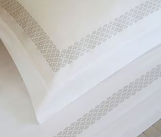 two white sheets with decorative lines on them