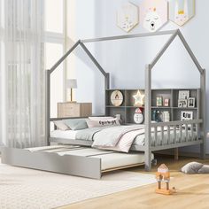 a child's bedroom with a bed, bookcases and toys on the floor