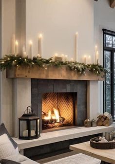 a living room filled with furniture and a fire place in front of a large window