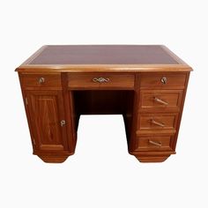 an antique wooden desk with drawers on the top and bottom, against a white background