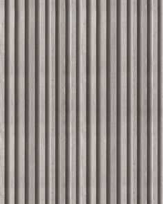 a gray and white striped wallpaper with vertical stripes