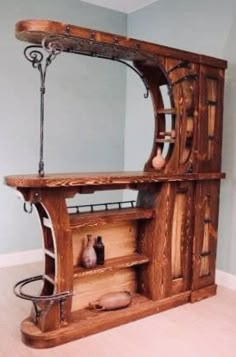 an old fashioned wooden cabinet with mirror on top