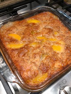 a casserole dish sitting on top of a stove with an egg topping in it