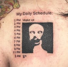 a man's back with a tattoo on it that says, my daily schedule