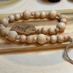 a wooden bead necklace on a table